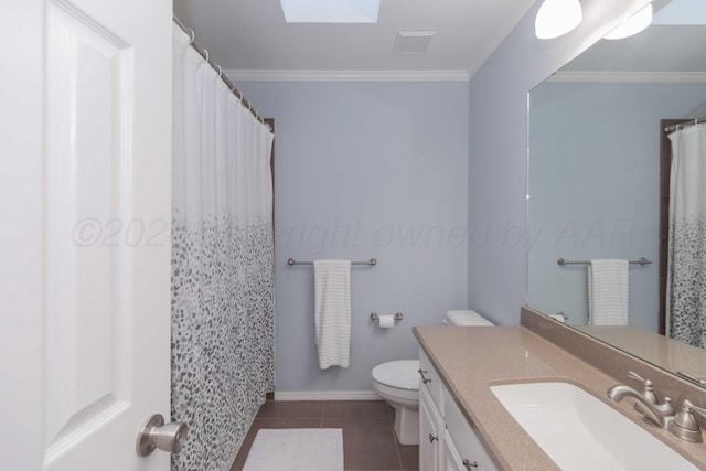 bathroom featuring a skylight, toilet, tile patterned flooring, and ornamental molding