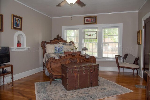 2122 S Hayden St, Amarillo, TX 79109 - bedroom with multiple windows, crown molding, wood finished floors, and a ceiling fan