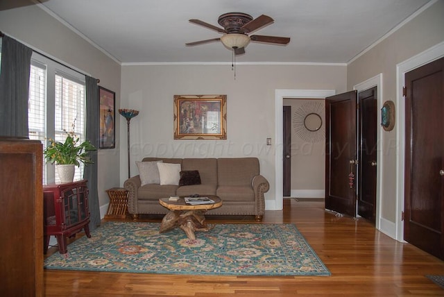 2122 S Hayden St, Amarillo, TX 79109 - living room featuring a ceiling fan, wood finished floors, and ornamental molding
