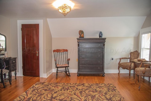 2122 S Hayden St, Amarillo, TX 79109 - sitting room with vaulted ceiling and wood finished floors