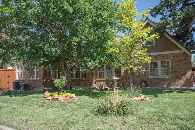 2122 S Hayden St, Amarillo, TX 79109 - view of front of property with brick siding and a front yard