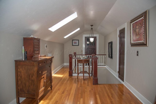 2122 S Hayden St, Amarillo, TX 79109 - dining space with a skylight, light wood finished floors, and lofted ceiling