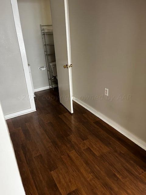 2122 S Hayden St, Amarillo, TX 79109 - unfurnished bedroom with baseboards and wood finished floors