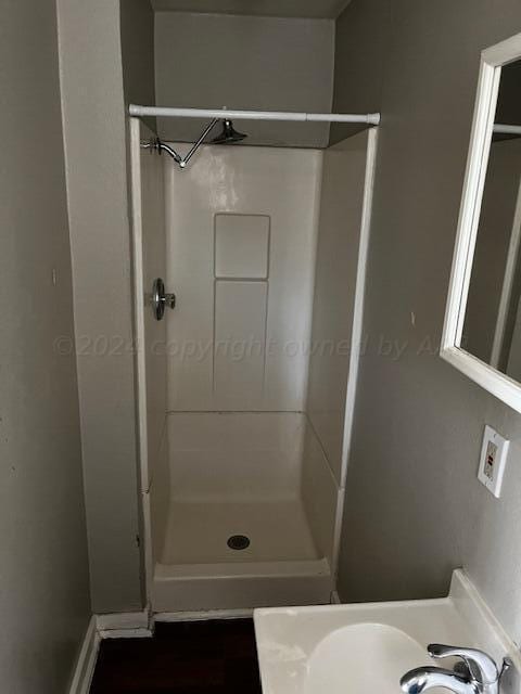 2122 S Hayden St, Amarillo, TX 79109 - bathroom featuring a shower stall and a sink