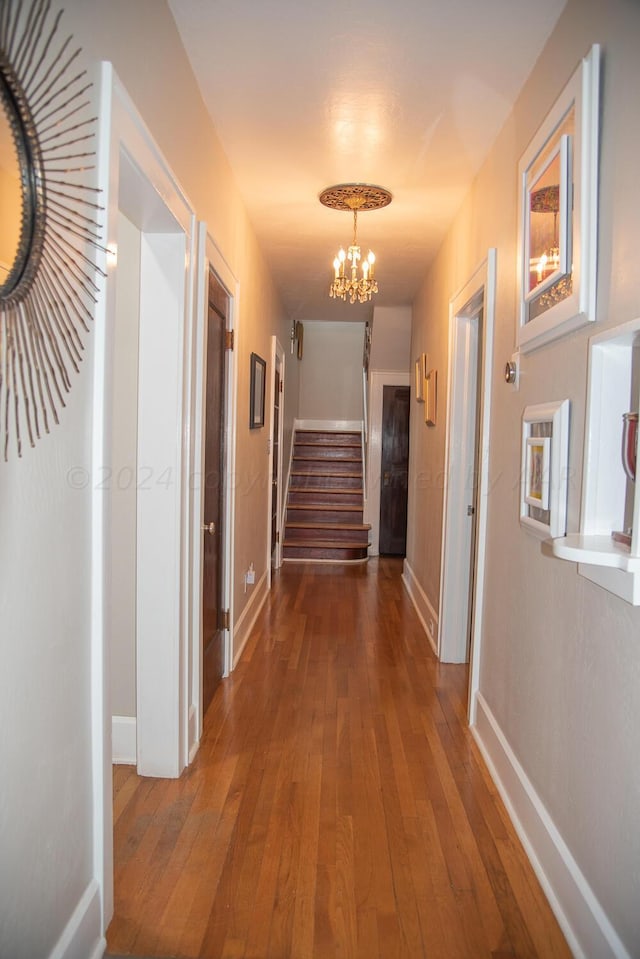 2122 S Hayden St, Amarillo, TX 79109 - corridor with hardwood / wood-style flooring, stairs, and a chandelier