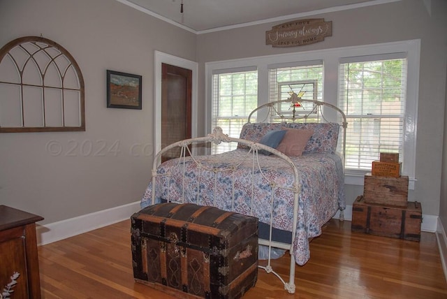 2122 S Hayden St, Amarillo, TX 79109 - bedroom with ornamental molding, wood finished floors, and multiple windows