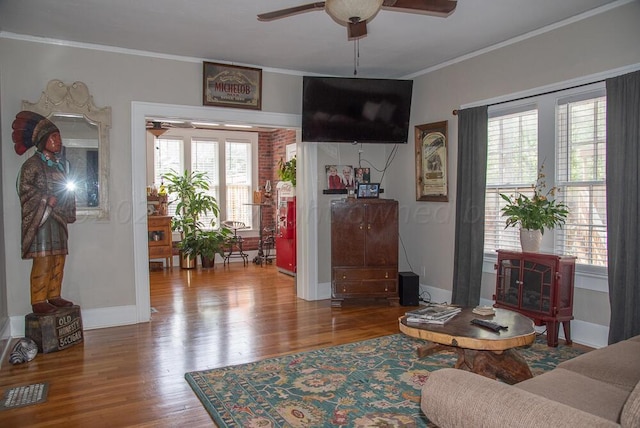 2122 S Hayden St, Amarillo, TX 79109 - living room with a ceiling fan, wood finished floors, and crown molding