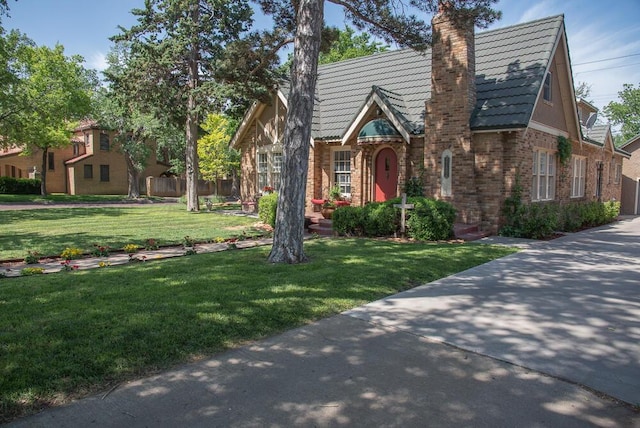 2122 S Hayden St, Amarillo, TX 79109 - english style home featuring brick siding and a chimney