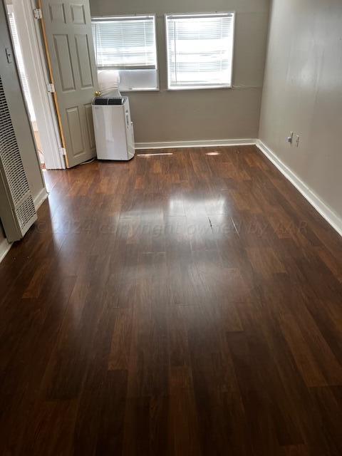 2122 S Hayden St, Amarillo, TX 79109 - empty room featuring baseboards and a heating unit