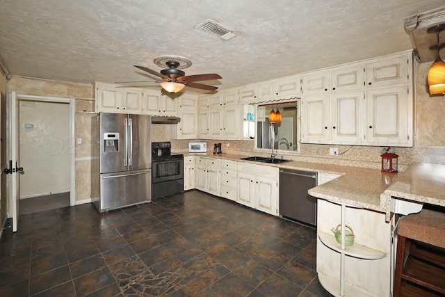 kitchen with stainless steel appliances, a sink, under cabinet range hood, a ceiling fan, and light stone countertops