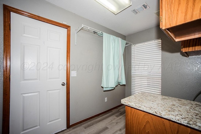 bathroom with hardwood / wood-style flooring