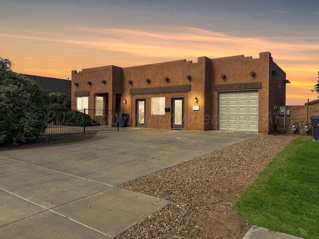 adobe home featuring a garage