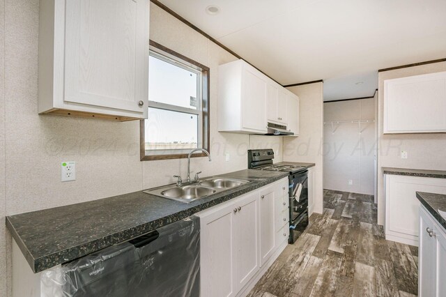 kitchen featuring white cabinetry, sink, black range with electric cooktop, and dark wood-type flooring