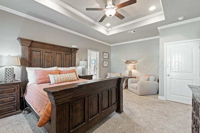 6702 Tatum Cir, Amarillo, TX 79119 - bedroom with light colored carpet, a tray ceiling, ornamental molding, recessed lighting, and a ceiling fan