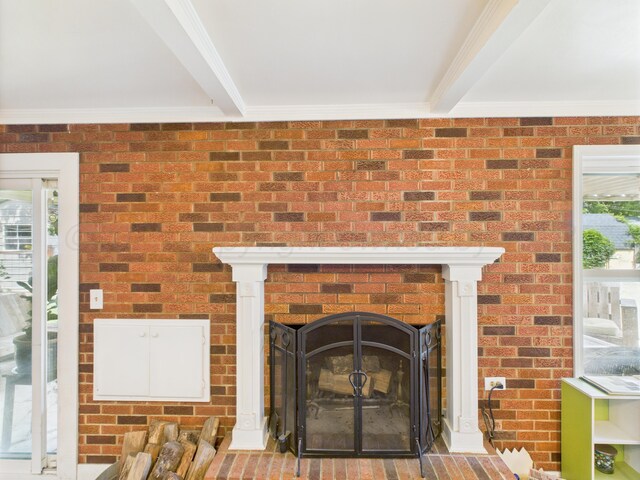 317 Morton Ave, Dumas, TX 79029 - detailed view of crown molding, beamed ceiling, and a fireplace