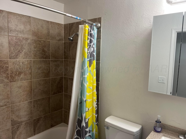 full bathroom featuring toilet and shower / bathtub combination with curtain