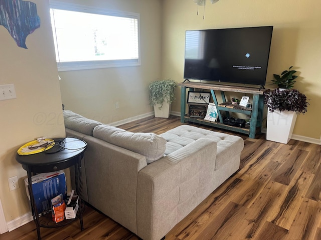 1025 Bowman Dr, Borger, TX 79007 - living room with wood finished floors and baseboards