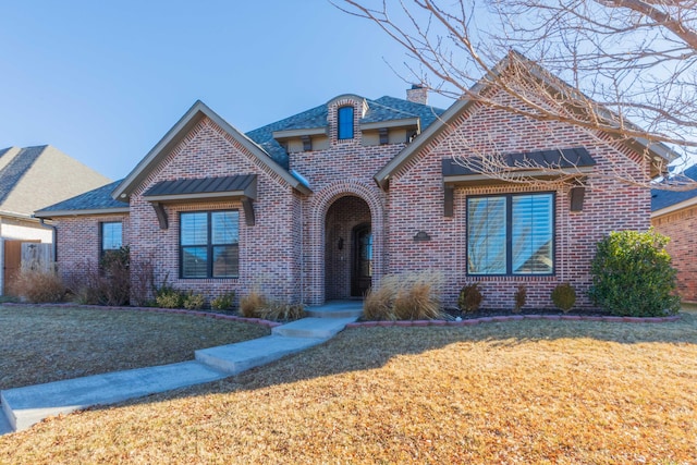 view of front of home with a front yard