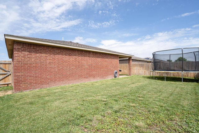 4607 Gloster St, Amarillo, TX 79118 - view of yard with a fenced backyard and a trampoline