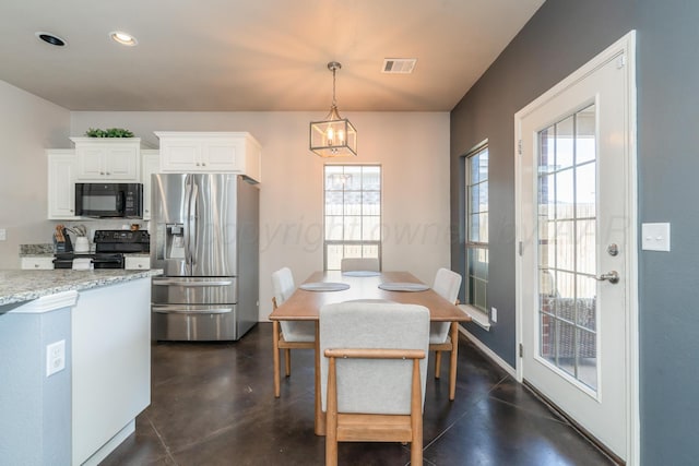 4607 Gloster St, Amarillo, TX 79118 - dining area featuring visible vents, finished concrete floors, plenty of natural light, and a notable chandelier