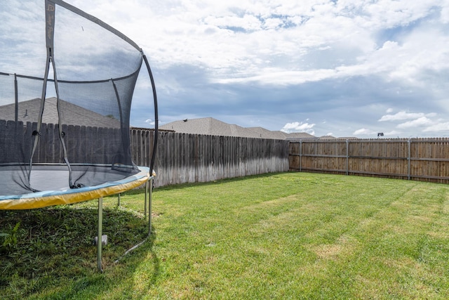 4607 Gloster St, Amarillo, TX 79118 - view of yard featuring a fenced backyard and a trampoline