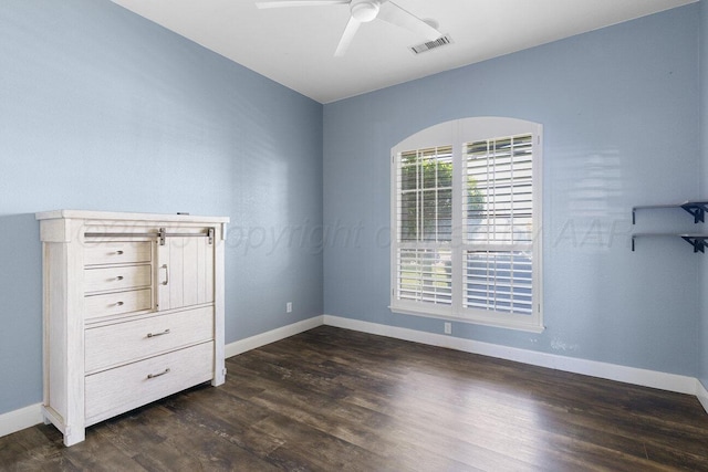 8121 Alexandria Ave, Amarillo, TX 79118 - unfurnished bedroom featuring dark wood finished floors, baseboards, and ceiling fan