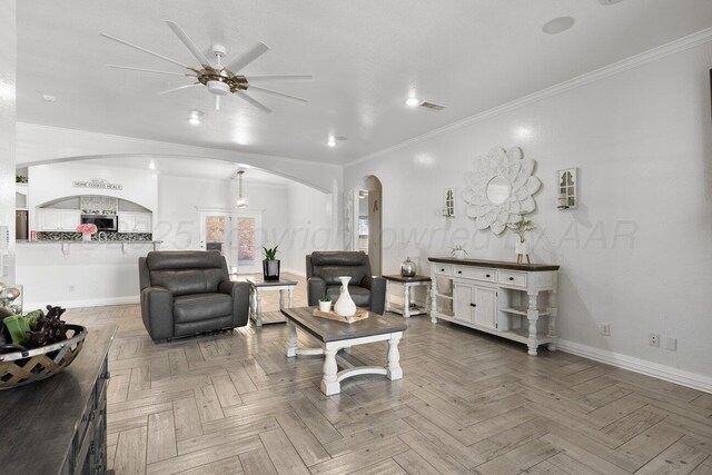 8121 Alexandria Ave, Amarillo, TX 79118 - living room featuring arched walkways, ceiling fan, baseboards, ornamental molding, and recessed lighting