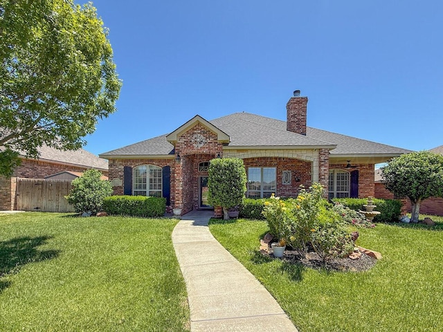 8121 Alexandria Ave, Amarillo, TX 79118 - view of front facade with brick siding, a chimney, and a shingled roof