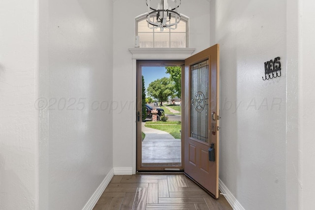8121 Alexandria Ave, Amarillo, TX 79118 - entrance foyer with baseboards and a chandelier