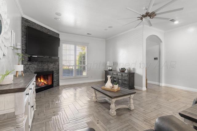 8121 Alexandria Ave, Amarillo, TX 79118 - living area featuring a large fireplace, arched walkways, baseboards, ceiling fan, and crown molding