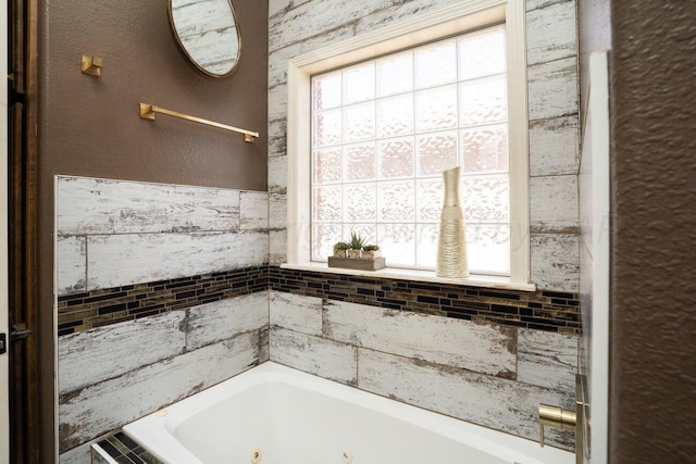 8121 Alexandria Ave, Amarillo, TX 79118 - bathroom featuring healthy amount of natural light and a tub with jets