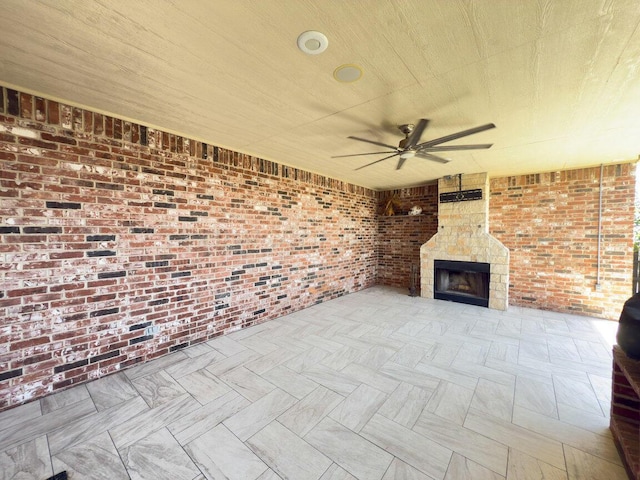 8121 Alexandria Ave, Amarillo, TX 79118 - view of patio with a ceiling fan and a large fireplace