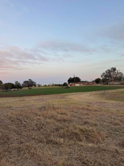 view of yard at dusk