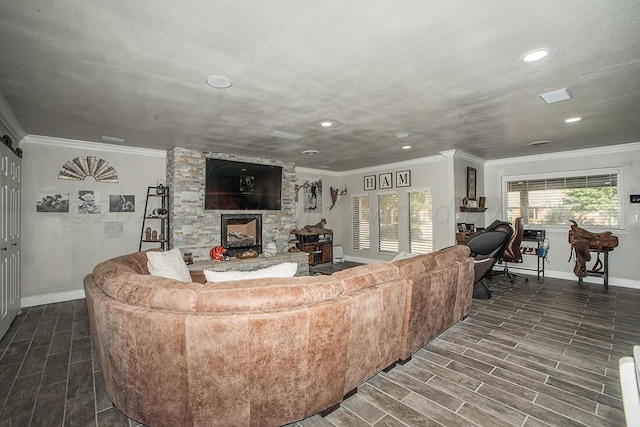 living room with ornamental molding, wood tiled floor, and baseboards