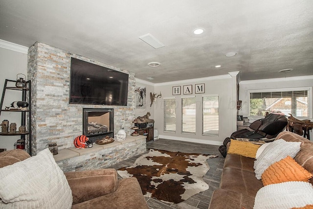 living room featuring baseboards, ornamental molding, and a stone fireplace