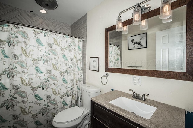 bathroom with toilet, curtained shower, and vanity