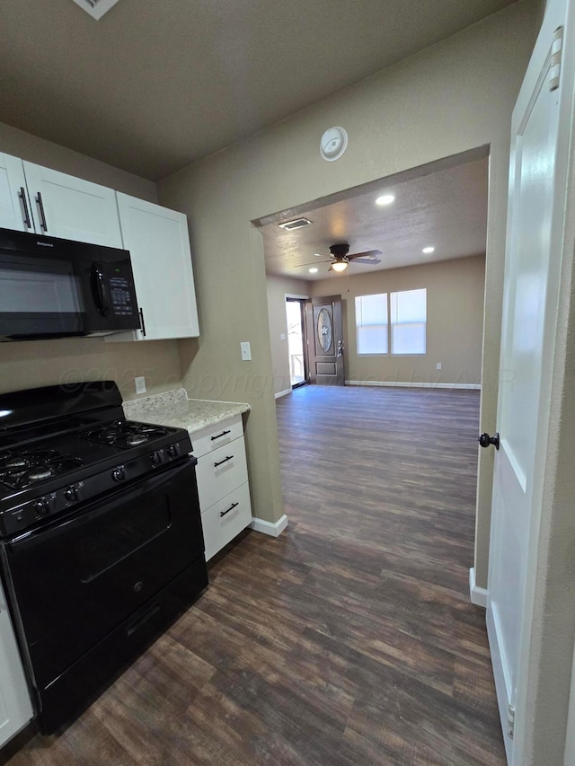 kitchen featuring white cabinetry, ceiling fan, dark hardwood / wood-style flooring, and black appliances