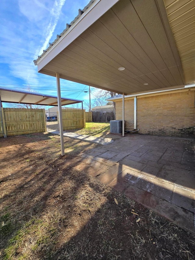 view of yard featuring central AC unit and a patio area