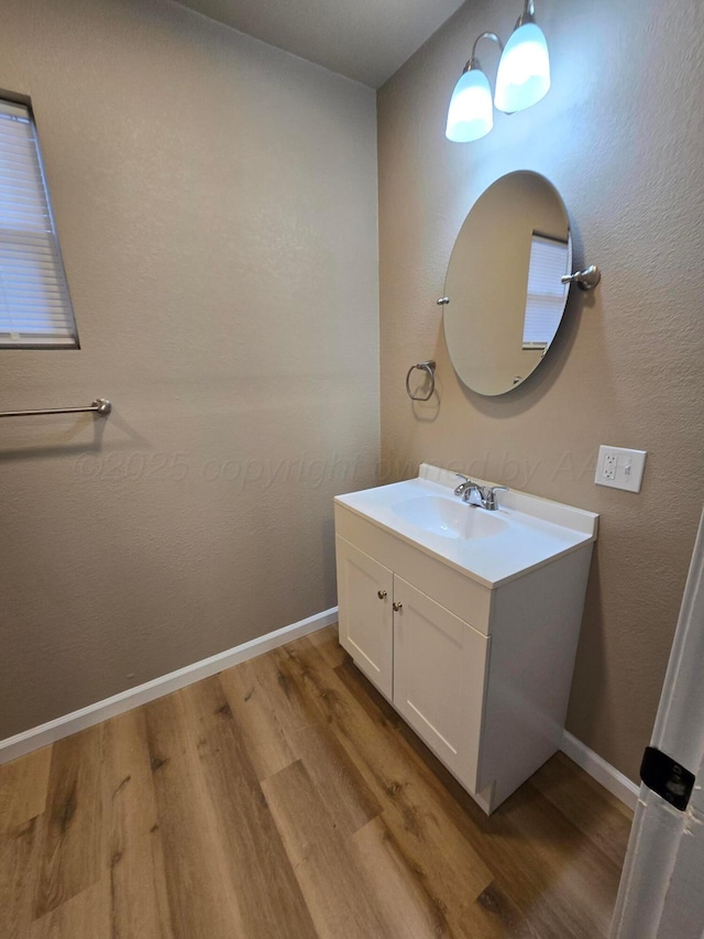 bathroom featuring vanity and hardwood / wood-style floors