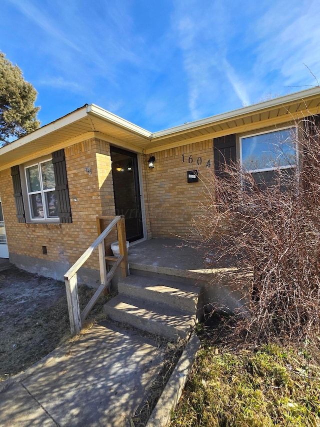 property entrance featuring a patio