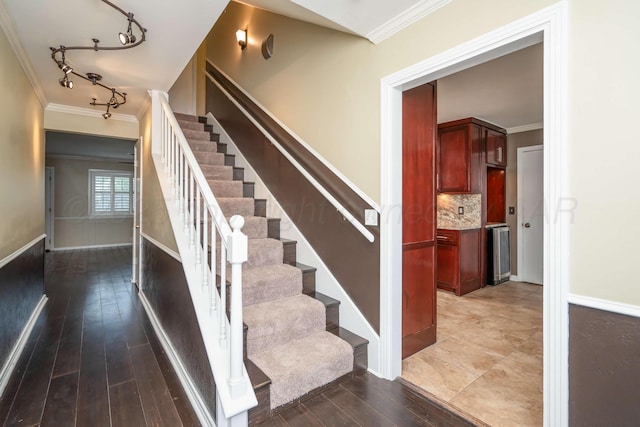 3408 Hawthorne Dr, Amarillo, TX 79109 - stairs with ornamental molding, wood finished floors, track lighting, and baseboards