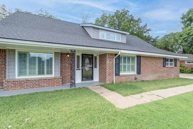 3408 Hawthorne Dr, Amarillo, TX 79109 - view of front of home with brick siding, a front yard, and roof with shingles
