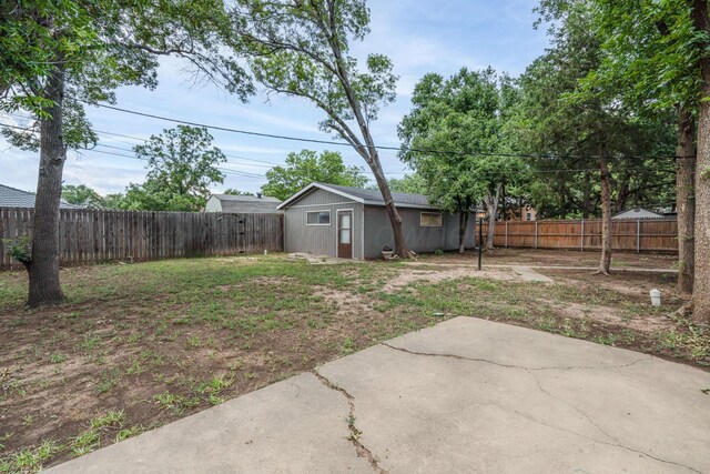 3408 Hawthorne Dr, Amarillo, TX 79109 - fenced backyard with a patio area