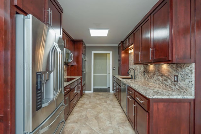 3408 Hawthorne Dr, Amarillo, TX 79109 - kitchen featuring appliances with stainless steel finishes, a sink, dark brown cabinets, decorative backsplash, and ornamental molding
