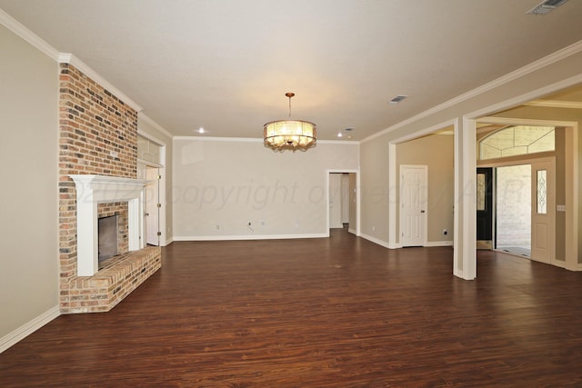 7501 Countryside Dr, Amarillo, TX 79119 - unfurnished living room with a chandelier, dark wood-style flooring, ornamental molding, baseboards, and a brick fireplace