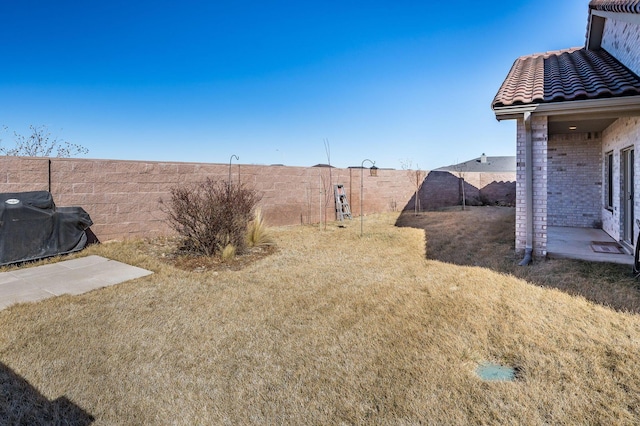 view of yard with a fenced backyard