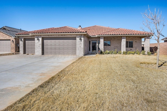 view of front of property featuring brick siding, a tile roof, a chimney, an attached garage, and driveway