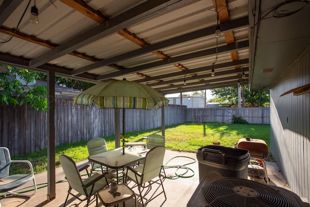 8219 Lamount Dr, Amarillo, TX 79110 - fenced backyard featuring a patio area and outdoor dining area