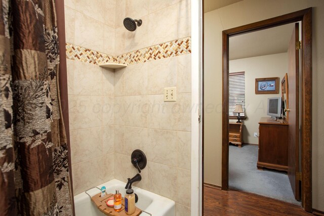 8219 Lamount Dr, Amarillo, TX 79110 - full bath with wood finished floors and shower / tub combo with curtain
