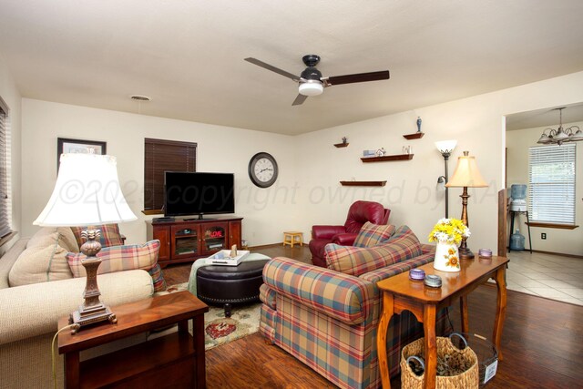 8219 Lamount Dr, Amarillo, TX 79110 - living room featuring a ceiling fan and dark wood-type flooring